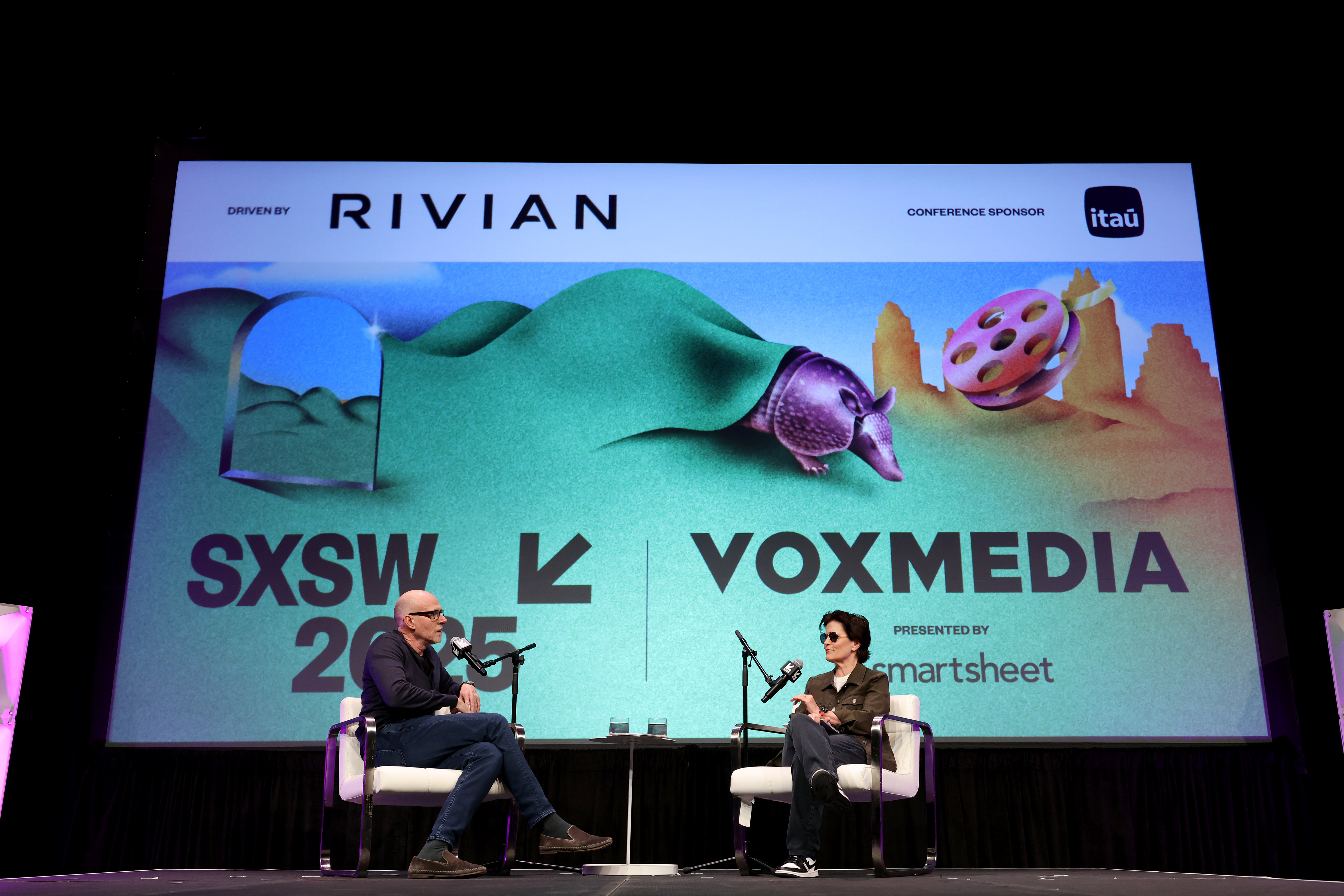 AUSTIN, TEXAS - MARCH 09: (L-R) Scott Galloway and Kara Swisher speak at the Pivot live podcast at the Vox Media Podcast Stage presented by Smartsheet At SXSW on March 09, 2025 in Austin, Texas. (Photo by Rick Kern/Getty Images for Vox Media)